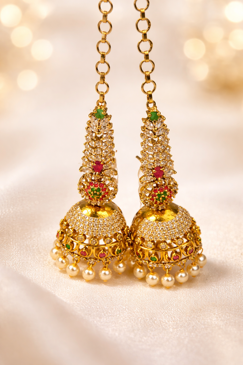 NERONI Gold-Plated CZ Stone Bridal Jhumka Earrings with Ear Chain – Pearl Drop Design