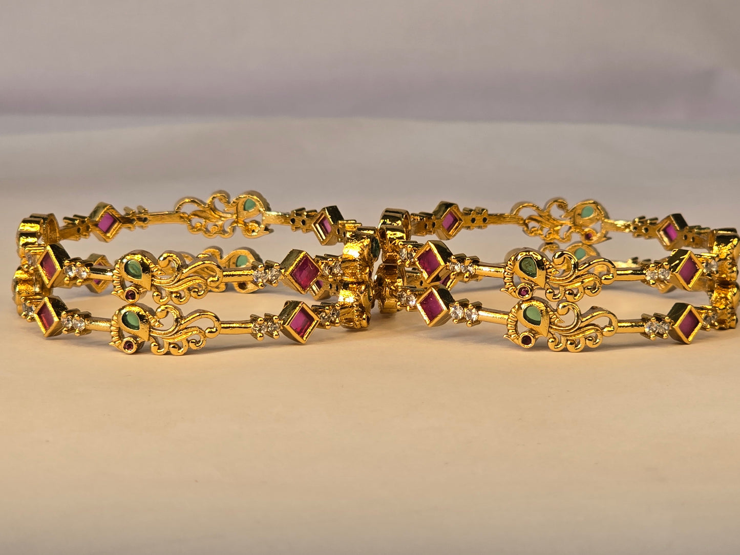 NERONI Gold-Plated Peacock Design Ruby & Emerald CZ Bangles – Royal Designer Edition (Pack of 4)