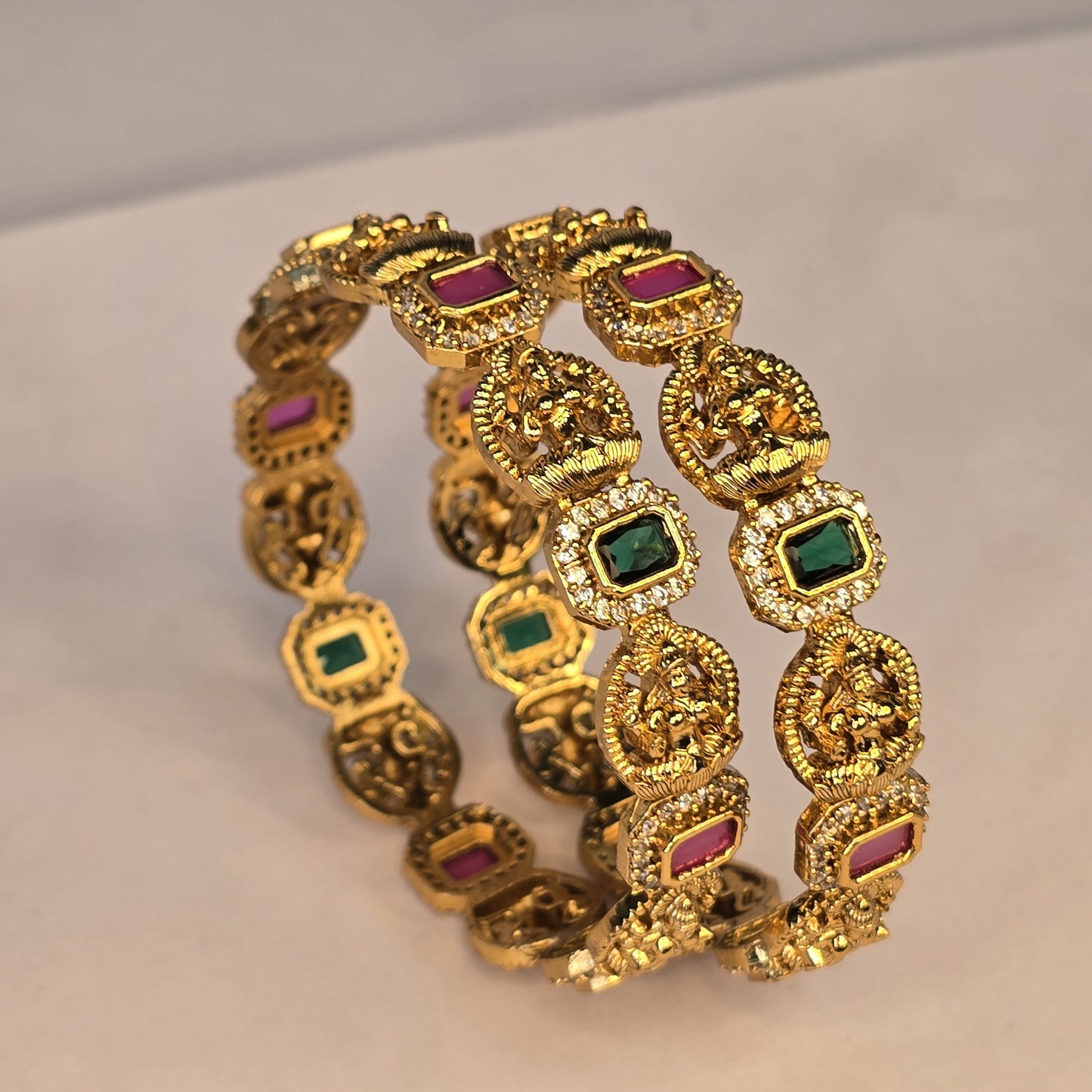Neroni Temple Elegance Bangles – Gold Finish with Green & Ruby Stones
